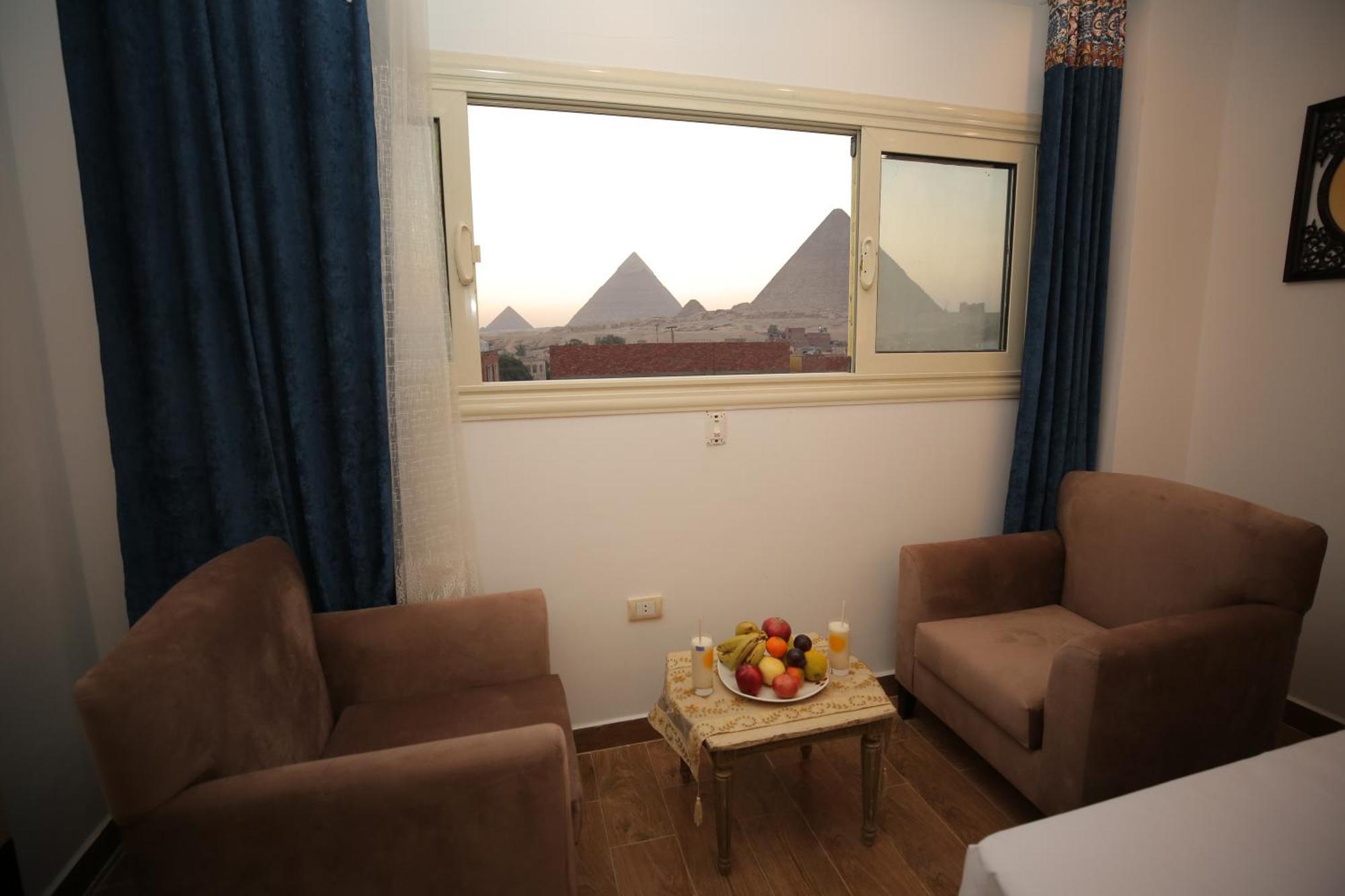 Hussien Lotus Pyramids View Cairo Exterior foto